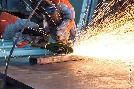 sparks during metal grinding in a steel factory