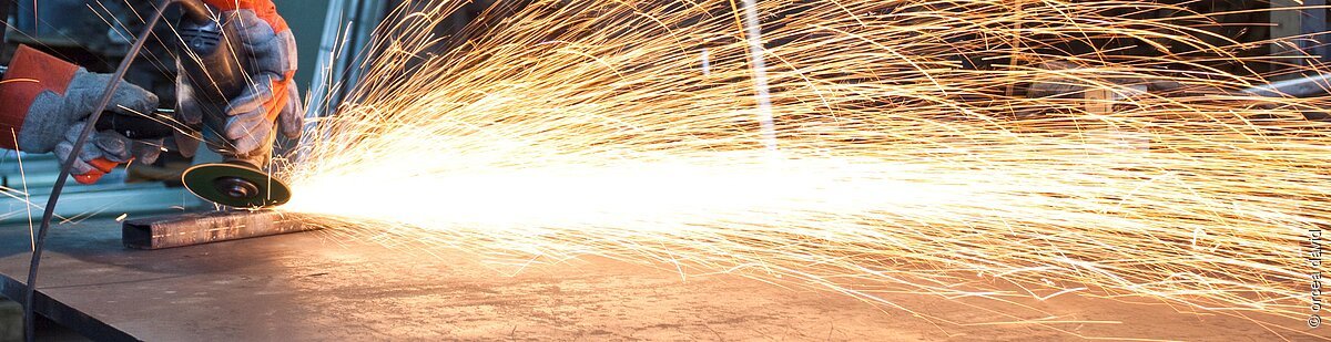 sparks during metal grinding in a steel factory
